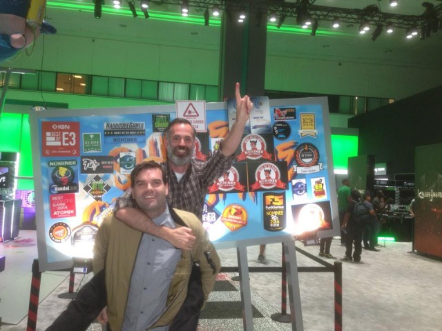 Sunset Overdrive Game Director Drew Murray celebrates a successful E3 2014 by jumping on Creative Director Marcus Smith's back